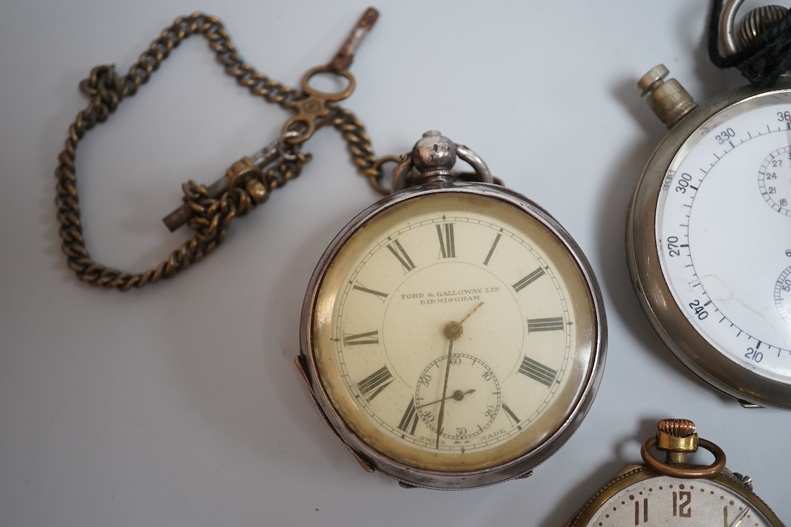 A late 1930's base metal cased Air Ministry spilt second stop watch, case diameter 60mm, together with a Swiss 935 standard open faced pocket watch, one other small white metal pocket watch and three base metal pocket wa